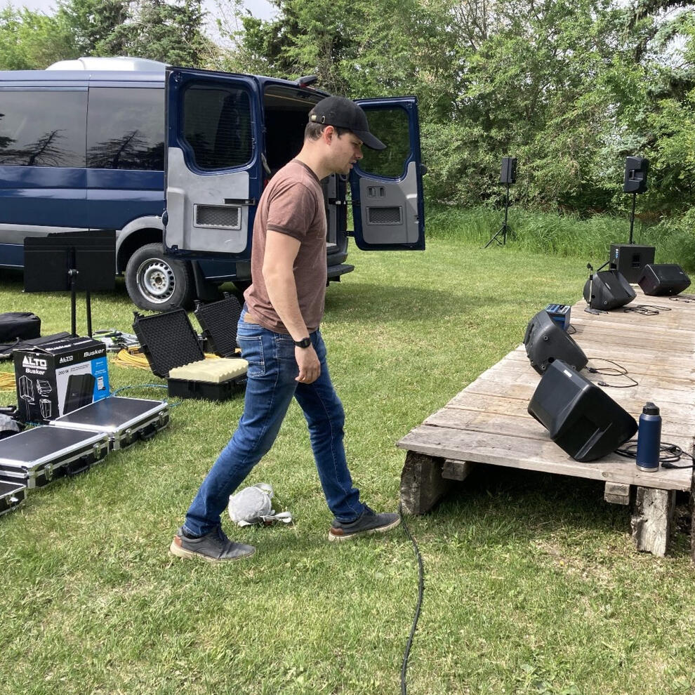 Setting up sound equipment for a weekend program