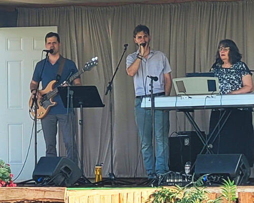 Playing and singing at the 1,000 Oaks Music Festival in Winkler, June 2026